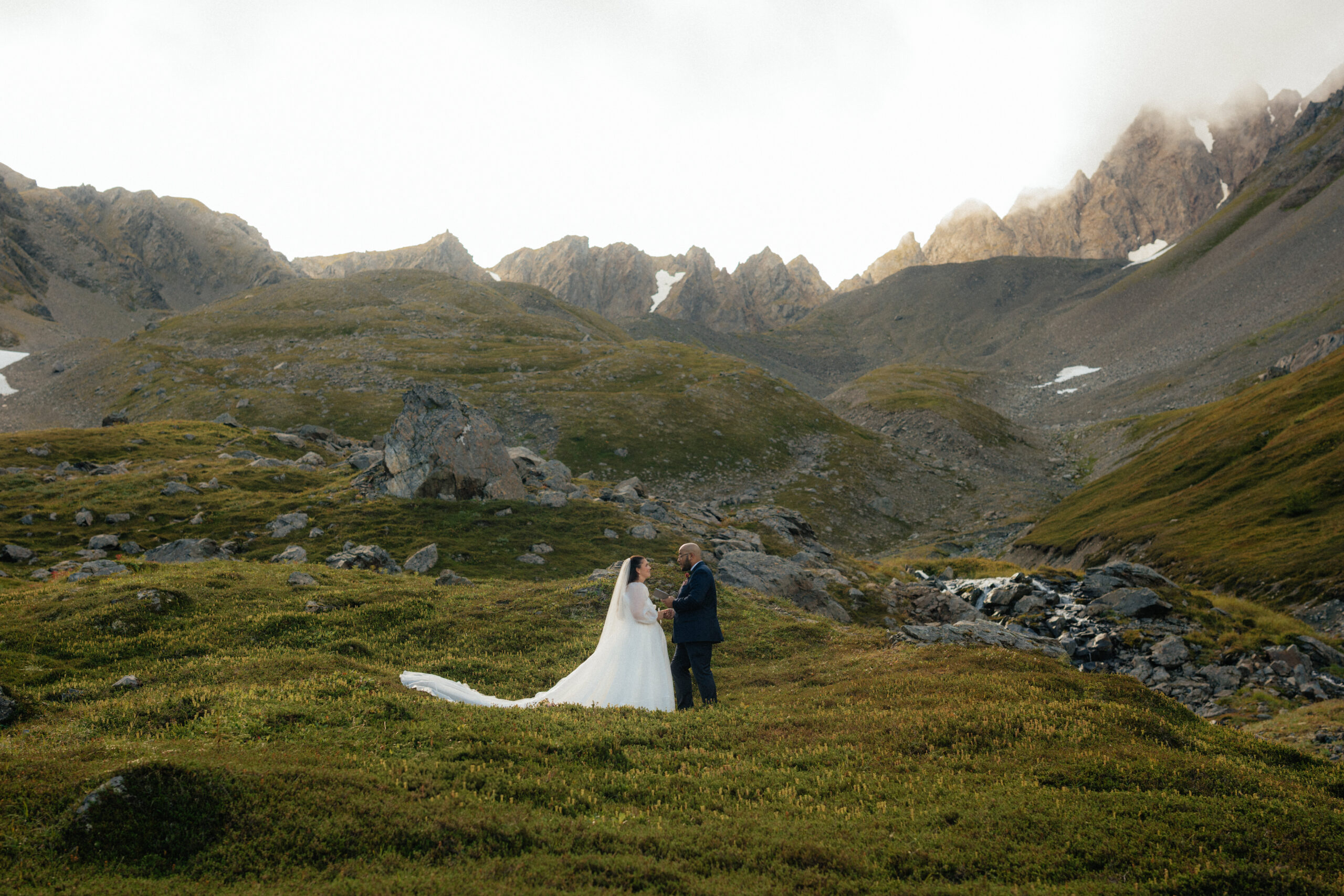 Bride and groom read private vows on Mount Marathon in Seward, Alaska